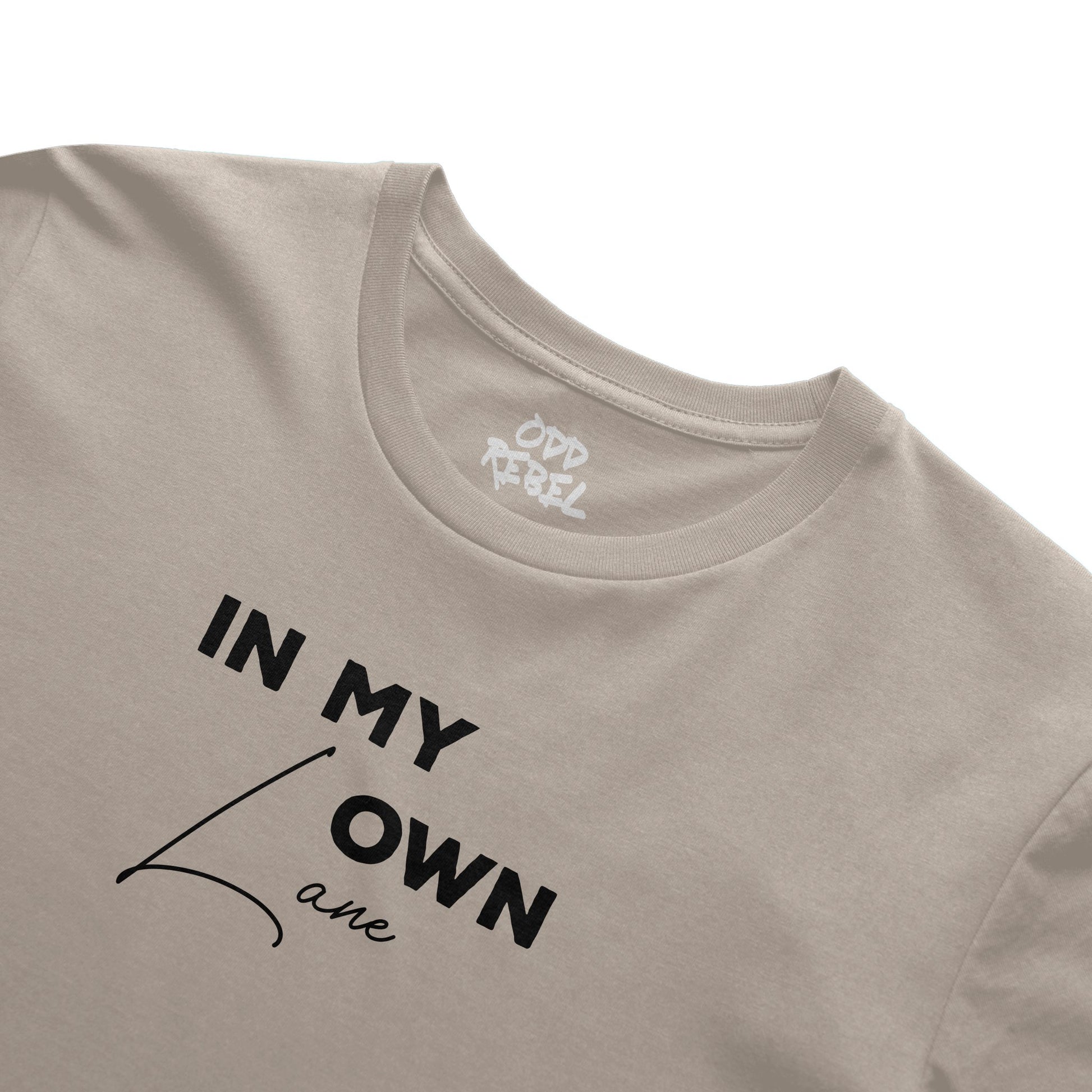 Close-up of minimalist slogan print on cream unisex t-shirt