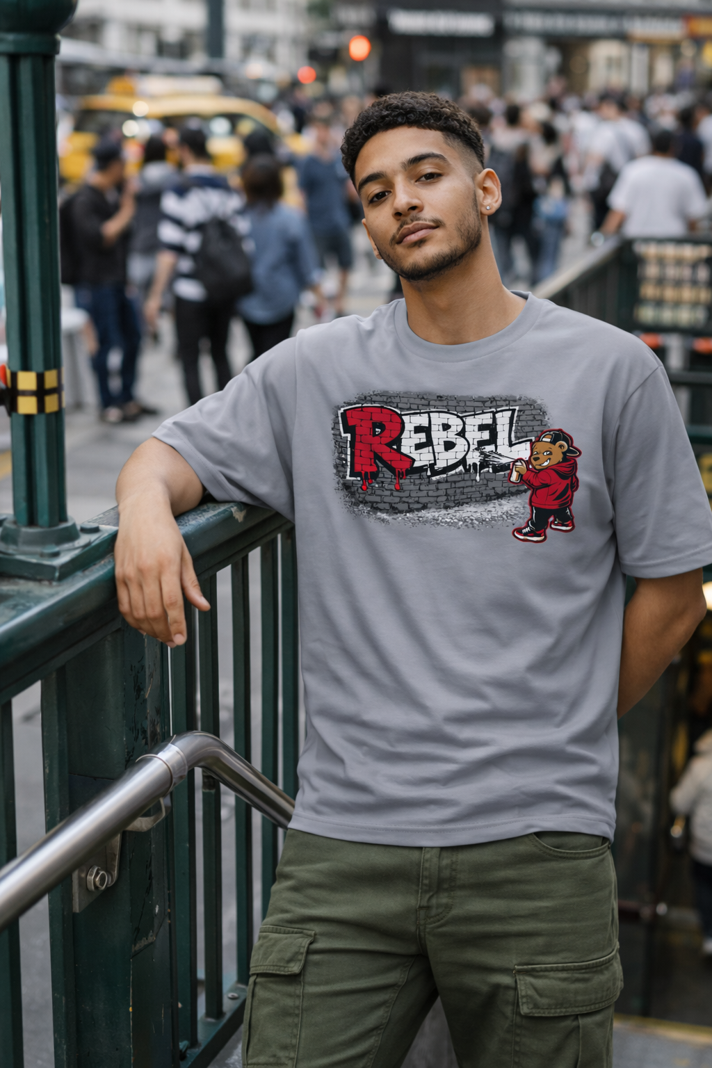 model wearing gray rebel bear graphic streetwear t-shirt in an urban setting