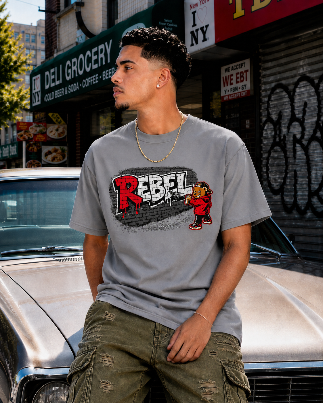 model wearing gray rebel bear graphic streetwear t-shirt in an urban setting